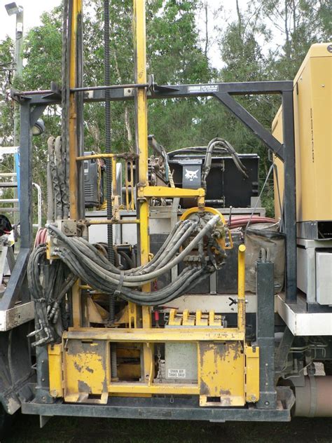 skid steer well drilling|bobcat mounted drill rig.